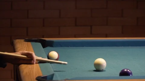 American Pool, young man is aiming to hit the cue ball. 120fps Video stock 83658699