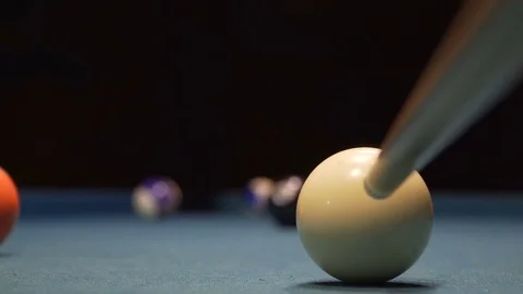 American Pool, young man is aiming to hit the ball in the pocket Stock Footage 83665332