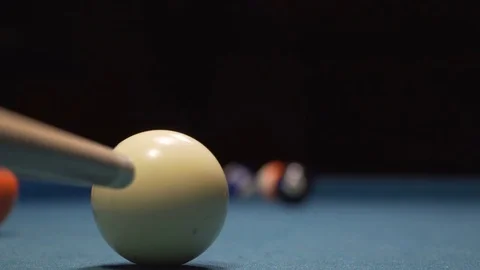 American Pool, young man is aiming to hit the ball in the pocket Stock Footage 83665741