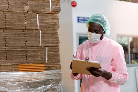 American raw material inspector work with computer to take note inspect data  Stock-Fotos