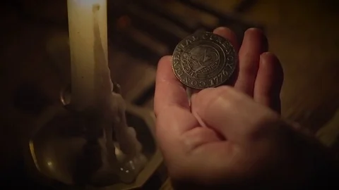 American Revolution | Colonial Coin by candlelight close up 1776 (2) Stock Footage