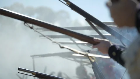 American Revolutionary War muskets fire on smoky battlefield. Stock Footage