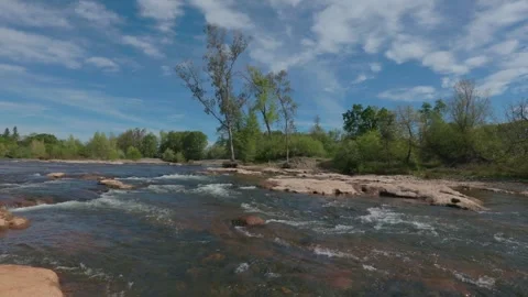 American River rapids flowing past rocks Stock Footage 332455211