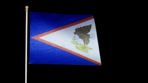 American Samoa flag blowing in the wind against black backdrop in 4k Stock Footage 108759835