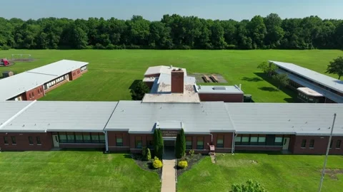 American school building during summer, no students. Empty campus. Aerial Video stock 201846733