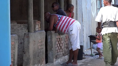 American sentiments in Cuba. US flag on the local man clothing Stock Footage 73669721