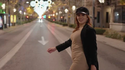 American side shot in motion of a pretty woman in a black coat and light brown Stock Footage 264113000