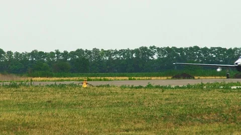 American single-engine aircraft Piper PA-46 taxis on runway. Close-up Stock Footage 106553603