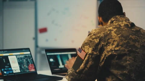 American soldier analyzing satellite data on laptop, studying military targets Stock Footage 264326547