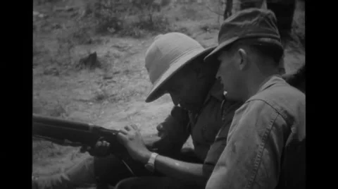 American soldier and Ethiopian soldier practicing rifle Stock Footage