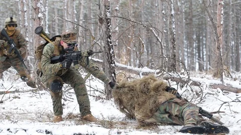 American soldier pull a killed comrade. another soldier aiming at the enemy Stock Footage 127514849