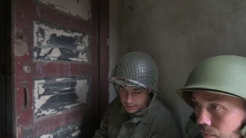 American soldiers using hand commands while taking cover in shelter Stock Footage 79972865