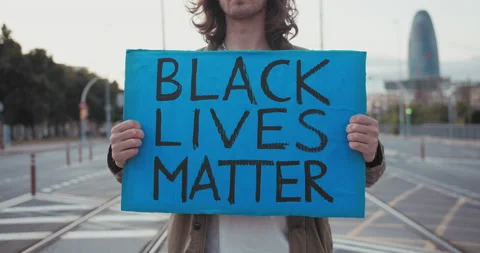 American student protest on the street for equal rights - Demonstrator holding Stock-Footage 140969460