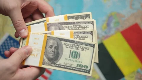 American trade representative passes stack of dollars to Belgian diplomat Stock Footage 331263834