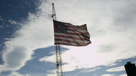 American_flag_waving_crane_sky_clouds Video stock 40647182
