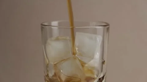 Americano Iced coffee on the table. Slow motion. Rotation. Stock Footage 272366384