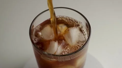 Americano Iced coffee on the table. Slow motion. Rotation. Stock Footage 272366434