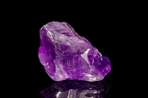 Amethyst gemstone on dark background Stock Photos