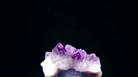 Amethyst gemstone in a ray of light Stock Footage 258837317