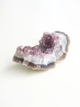 Amethyst geode side view for crystal therapy treatments and reiki Stock Photos