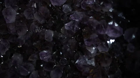 Amethyst raw crystal light sweep Stock Footage 46710774