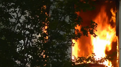 Amid the Force of Nature - House Fire Through the Window Video stock 34696040