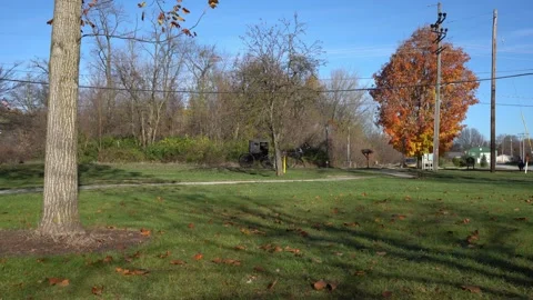 An Amish horse and buggy passing by in a small town Stock Footage 292397958