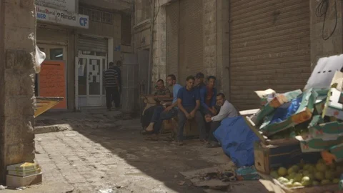 Amman Jordan men sitting in street 1 Canon C LOG Stock Footage