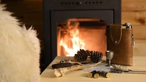Ammunition for hunting on the table by the fireplace Stock Footage 72021084