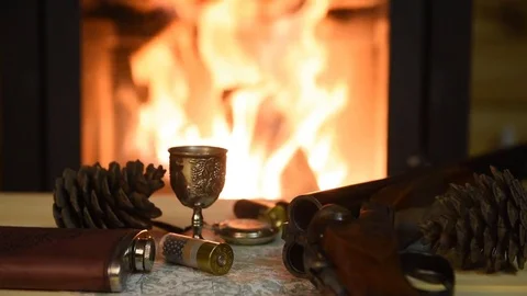 Ammunition for hunting on the table by the fireplace Stock Footage 72021089