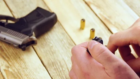 Ammunition with traumatic pistol Stock Footage 105705952