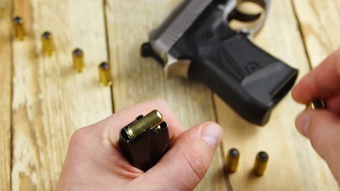 Ammunition with traumatic pistol Stock Footage 105709650