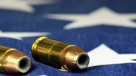 Ammunition on United States flag - Second Amendment Rights Stock Footage 59805749