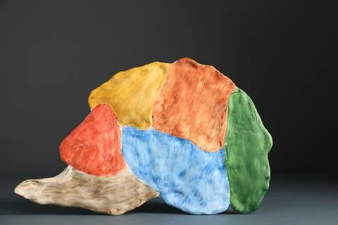Amnesia problem. Brain with sections on grey background Stock Photos