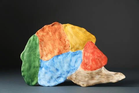 Amnesia problem. Brain with sections on grey background Stock Photos