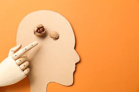 Amnesia problem. Paper cutout of human head, mannequin hand and broken waln.. Stock Photos