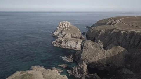 Among the cliffs over the sea 4k ungraded Stock Footage 105963636