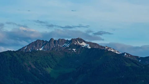 Among the clouds and mountain peaks TIME LAPS Stock Footage 320523334