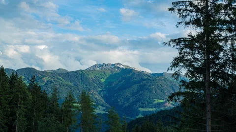 Among the clouds and mountain peaks TIME LAPS Stock Footage 320523339