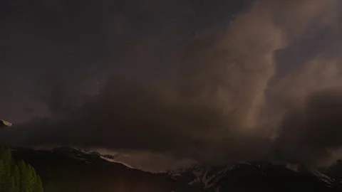 Among the clouds and mountain peaks TIME LAPS Stock Footage 321068234