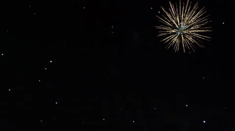 Among falling white sparks, golden chrysanthemum-like aerial displays burst and Stock Footage 59126050