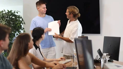 Among students of computer courses, male teacher awards diploma and to excellent Stock Footage 306977674