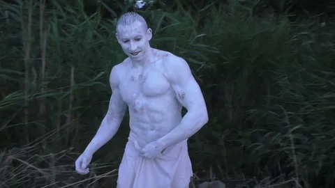 Among the tall grass is an alien man. Stock Footage