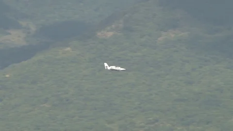 Amphibious aircraft Be-103 performs horizontal flight in Gelendzhin Bay. Stock Footage 120777536