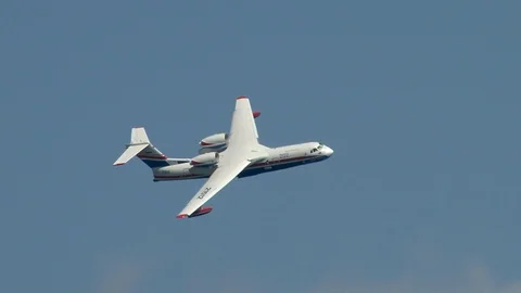 Amphibious aircraft Be-200ES performs aerobatics over waters of Bay. Stock Footage 120804194