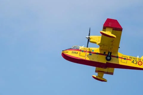 Amphibious aircraft flying aiding wildfire suppression efforts Stock Photos