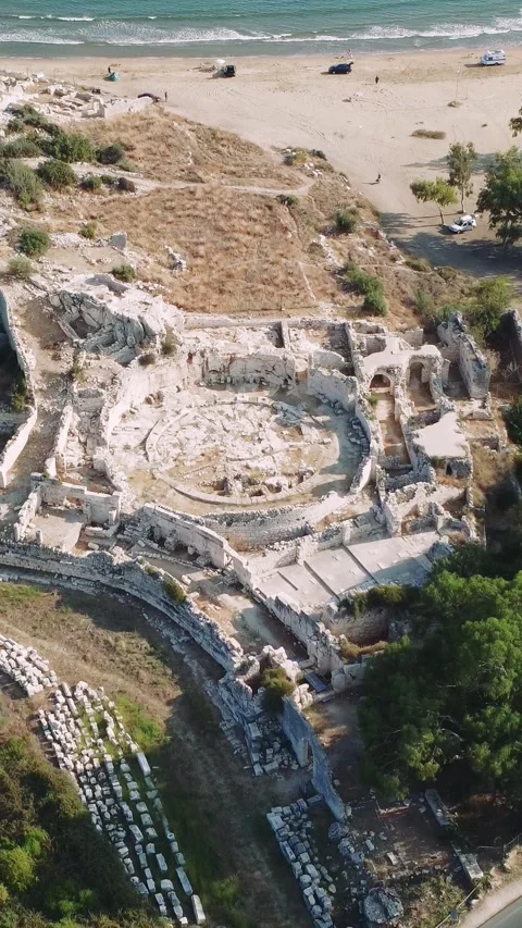 Amphitheater in ancient city of the Agora. Dramatic sunset sky. Mersin, Turkey Stock Footage 253435873