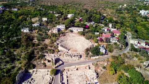 Amphitheater in ancient city of the Agora. Dramatic sunset sky. Mersin, Turkey Stock Footage 253823401