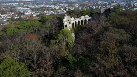 Amphitheater ruins in the middle of the forest with the view of the city, 4k Stock Footage 342938965