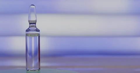 Ampoule on an abstract background. Stock Footage 144833635